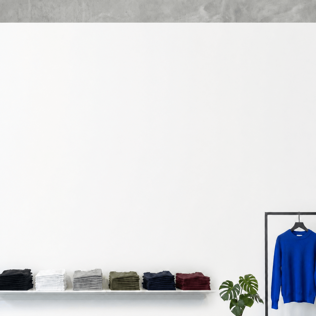 TEESHOPPEN clothing displayed in a bright store